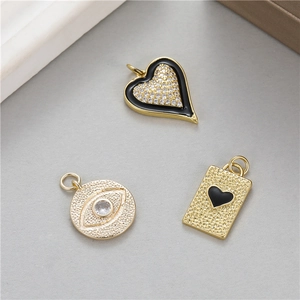 Three gold evil eye heart pendants with crystal inlay and black enamel finish for DIY jewelry