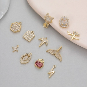 Variety of 14K gold plated charms with zircon stones in cat, fish tail and apple shapes