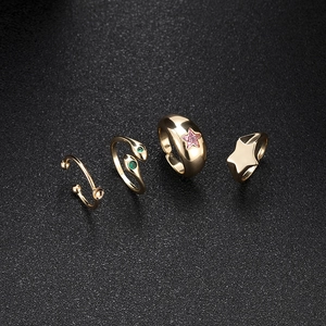 Detailed view of 14K gold plated rings set featuring snake and star zircon designs