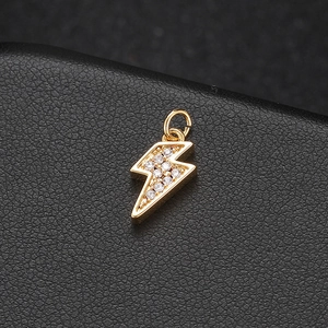 14K gold plated lightning bolt pendant with sparkling cubic zirconia on black leather