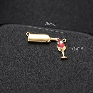 Macro shot of 14k gold-plated wine glass pendant with dimensions 26mm x 17mm