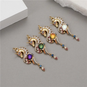 Luxurious seahorse pendants with colored cubic zirconia and oval gemstones in gold setting