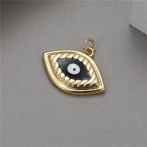 14K gold evil eye pendant with black and white enamel detail for jewelry making