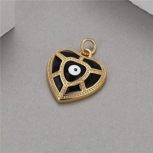14K gold evil eye heart pendant with black and white enamel and gold lattice detail