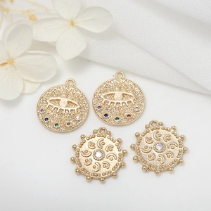 Minimalist 14K gold evil eye pendants with colorful crystals and hammered texture