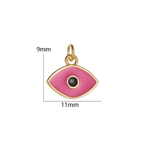 Macro detail of a 9x11mm pink evil eye charm with gold plating for jewelry making