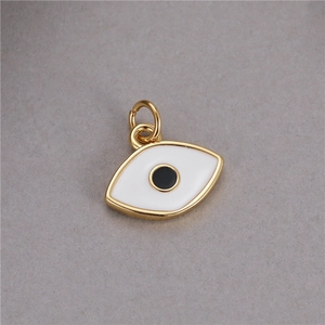 Macro view of gold-rimmed Evil Eye pendant with white enamel and black oil drop detail