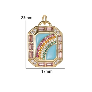 Detail view of a 23x17mm copper rainbow pendant with colorful zircon and blue enamel