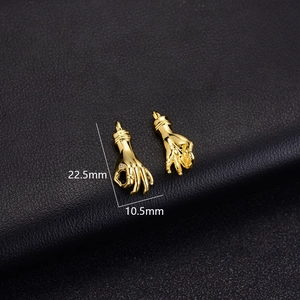 Detail view of 14K gold-plated hand pendants with micro-pave zircon and 22.5mm size