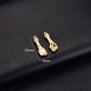 Detail view of 14K gold-plated Mano Fico hand charms with micro-pave cubic zirconia