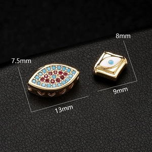 Macro detail of almond and square Evil Eye jewelry beads with dimensions 13mm and 9mm