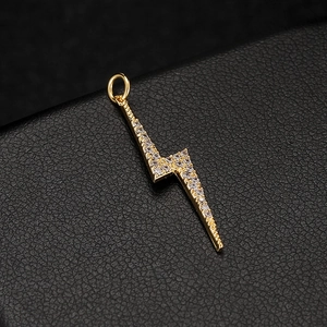 14k gold plated lightning bolt pendant with white cubic zirconia on black leather