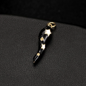 Retro black cow horn pendant with gold stars and white patterns on leather texture