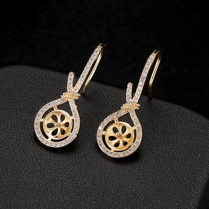 Elegant gold-plated silver earring hooks with twisted knot design and zircon micro-pave