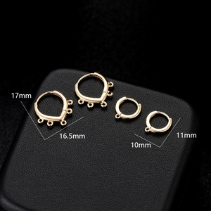 Detailed view of polished gold earring hoops in 17mm and 10mm sizes for DIY jewelry
