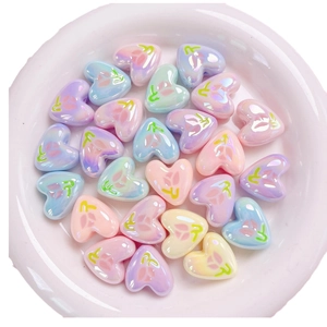 Iridescent heart-shaped beads with tulip patterns in assorted macaron pastel colors