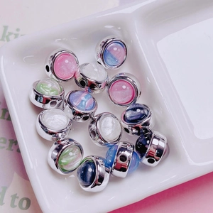 Detailed view of silver-edged star acrylic beads in pastel colors for DIY jewelry making