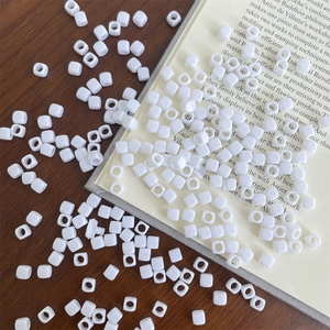 Detail view of square white acrylic macaron beads for DIY jewelry and phone chain making