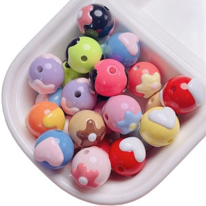 Colorful floral heart beads for DIY jewelry making in a white minimalist tray