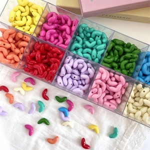 Colorful V-shaped acrylic beads set in a clear organizer for DIY jewelry making