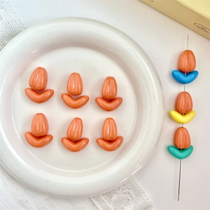 Detailed macro view of colorful tulip-shaped acrylic beads for DIY jewelry making