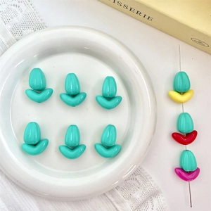 Detailed view of colorful tulip-shaped lacquer beads for DIY jewelry and phone chain making