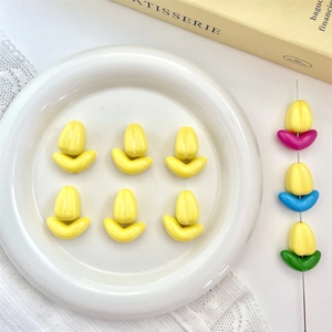 Detailed view of tulip-shaped DIY beads with yellow buds and colorful leaf bases