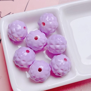 Macro shot of light purple pineapple patterned acrylic beads for DIY jewelry making