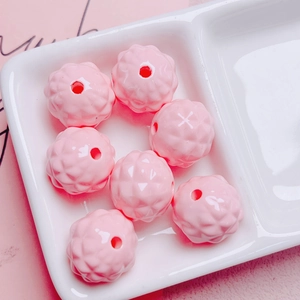 Macro detail of faceted pink pineapple acrylic beads with center holes for DIY crafting