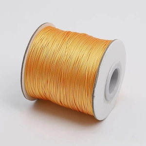 Primer plano de cordón encerado naranja dorado de 1-2mm para joyería DIY y cuentas