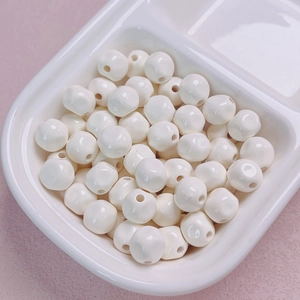 Close-up of 10mm glossy ivory acrylic beads for DIY jewelry and phone chain making