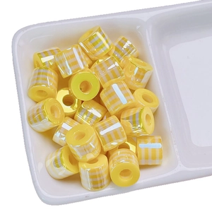 Cylindrical yellow and white striped resin beads for DIY bracelets and necklace crafts