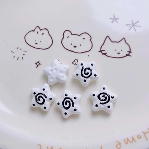 Macro shot of 5pcs star acrylic beads with spiral patterns for DIY jewelry making