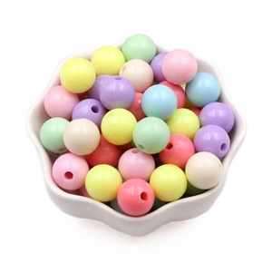 Macaron color acrylic beads for DIY jewelry and phone chains in a white bowl