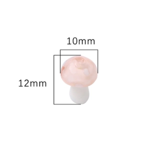 Macro shot of a pink resin mushroom charm showing dimensions of 12mm height and 10mm width