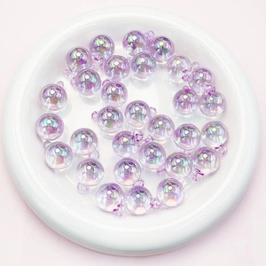 Macro view of 16mm iridescent light purple round acrylic pendant beads for DIY jewelry