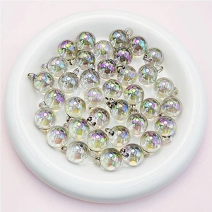 Macro shot of 16mm iridescent UV coated acrylic beads in a ceramic tray for DIY jewelry