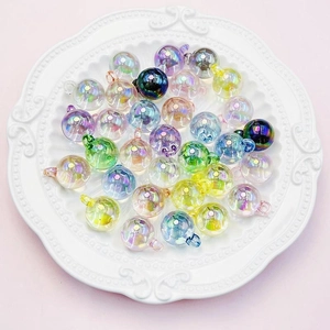 Close-up of 16mm iridescent UV coated acrylic beads with top hanging holes for DIY jewelry