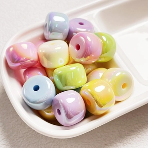 Macro view of colorful acrylic beads with pearlescent finish for DIY jewelry crafts