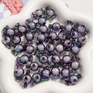 Dettaglio di perline viola a forma di caramella con rivestimento AB per gioielli fai-da-te