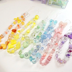 Colorful acrylic beaded phone lanyards with star, heart, and smiley face charms