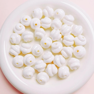 Detailed view of white spiral acrylic loose beads for DIY jewelry and phone chain making