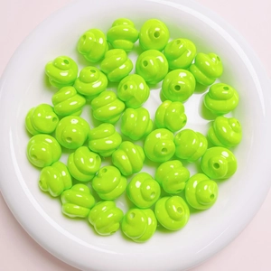 Macro view of neon green spiral textured beads with center holes for DIY jewelry