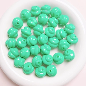 Macro detail of mint green spiral twisted beads for DIY jewelry and phone chains