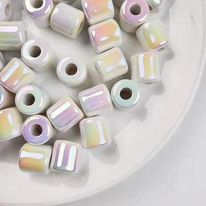 Macro shot of iridescent barrel beads for DIY jewelry with rainbow AB coating