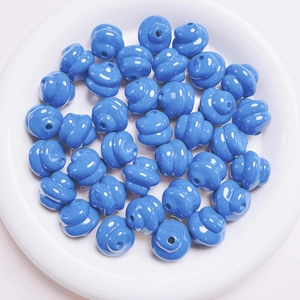 Macro shot of bright blue spiral loose beads for DIY jewelry and phone chain making