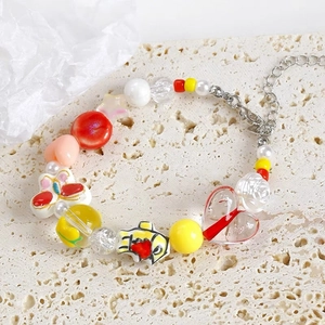 Handmade colorful acrylic heart beads and star charms on a stainless steel link bracelet