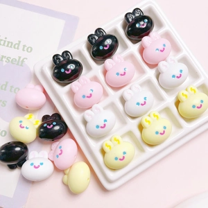 Macro detail of 20mm acrylic bunny beads in assorted colors for DIY jewelry making