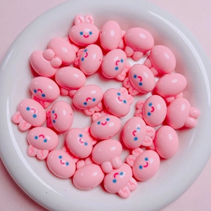 Close-up of cute pink 20mm acrylic rabbit head beads for DIY jewelry making