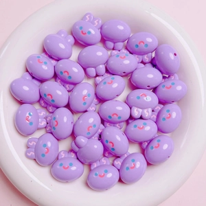 Close-up of cute light purple acrylic bunny charms for DIY jewelry and phone chains